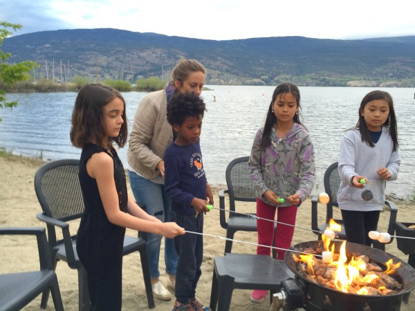 Fireside s'mores with new friends by the lake